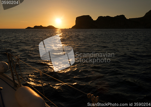 Image of Sunset, sea and sailing boat