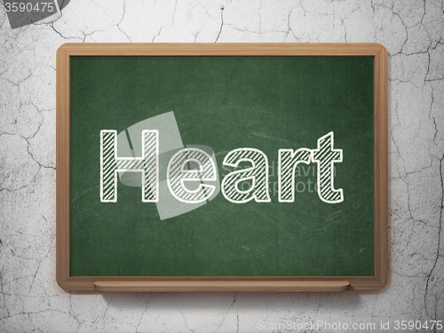 Image of Medicine concept: Heart on chalkboard background