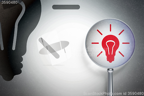 Image of Finance concept:  Light Bulb with optical glass on digital background