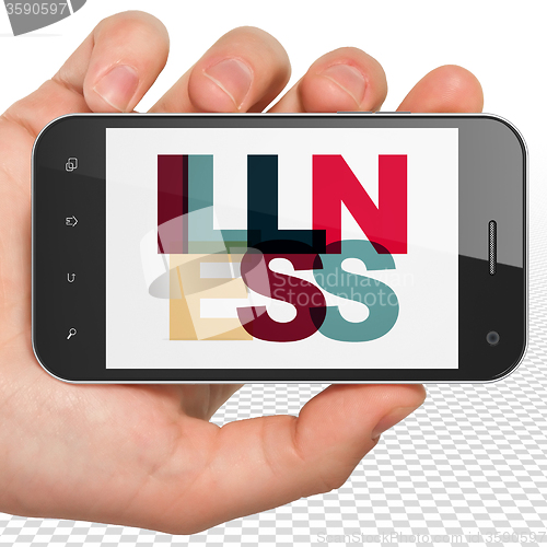 Image of Healthcare concept: Hand Holding Smartphone with Illness on  display