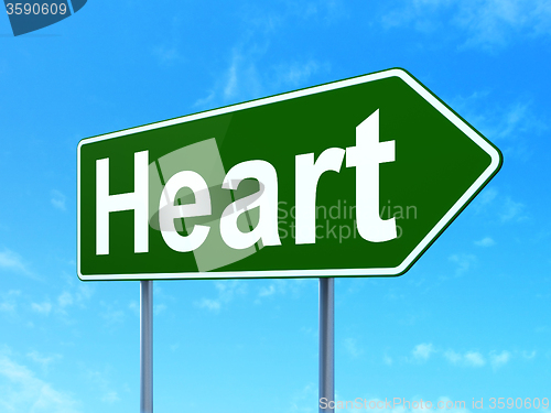 Image of Medicine concept: Heart on road sign background