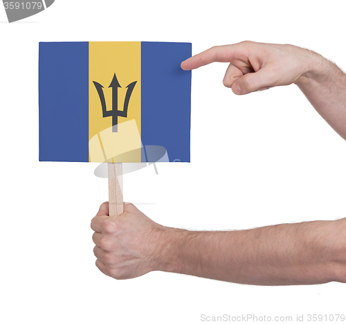 Image of Hand holding small card - Flag of Barbados