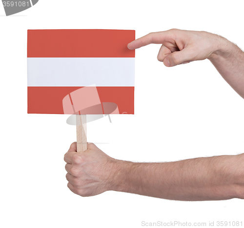 Image of Hand holding small card - Flag of Austria