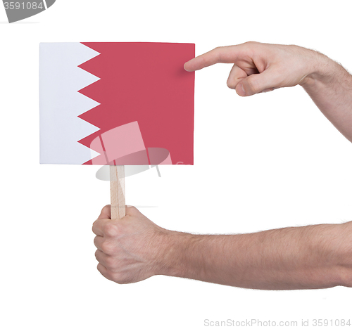 Image of Hand holding small card - Flag of Bahrain