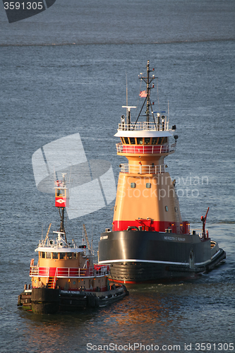 Image of Two tugboats sailing in East River