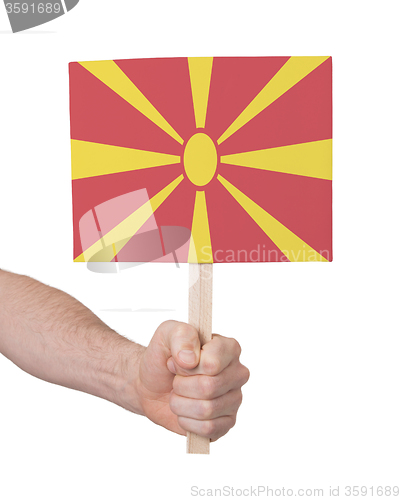 Image of Hand holding small card - Flag of Macedonia