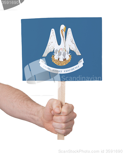 Image of Hand holding small card - Flag of Louisiana