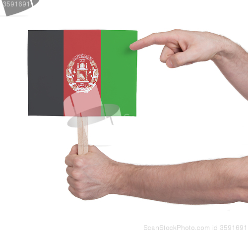 Image of Hand holding small card - Flag of Afghanistan