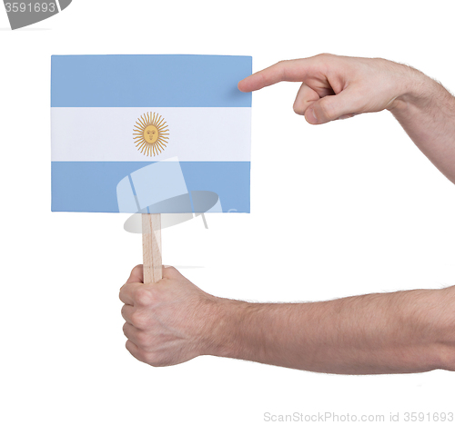 Image of Hand holding small card - Flag of Argentina