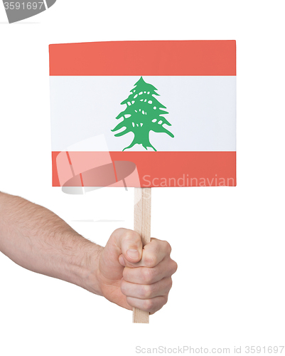 Image of Hand holding small card - Flag of Lebanon
