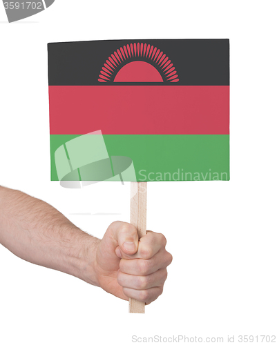 Image of Hand holding small card - Flag of Malawi