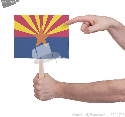 Image of Hand holding small card - Flag of Arizona