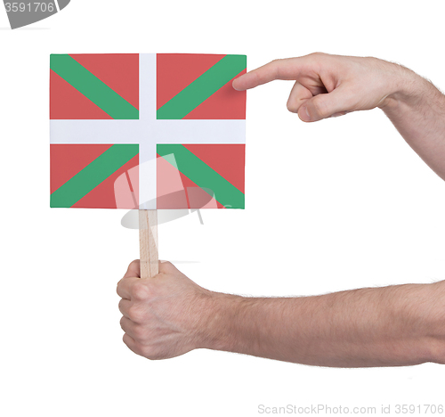 Image of Hand holding small card - Flag of Basque Country