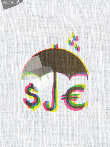 Image of Protection concept: Money And Umbrella on fabric texture background