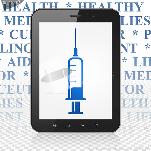 Image of Medicine concept: Tablet Computer with Syringe on display