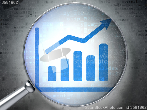 Image of Marketing concept: Growth Graph with optical glass on digital background