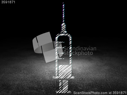 Image of Health concept: Syringe in grunge dark room