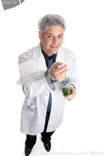 Image of Scientist adding measured sample to flask