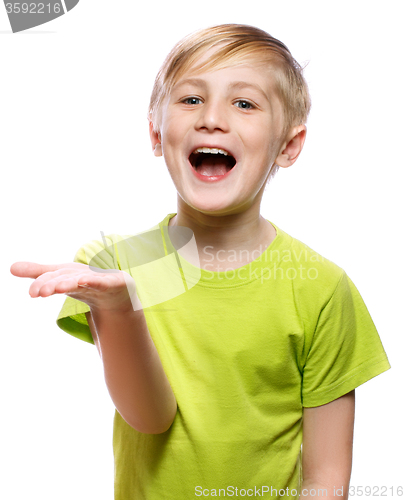 Image of Boy showing something