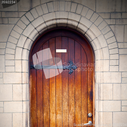 Image of wooden parliament in london old church door and marble antique  