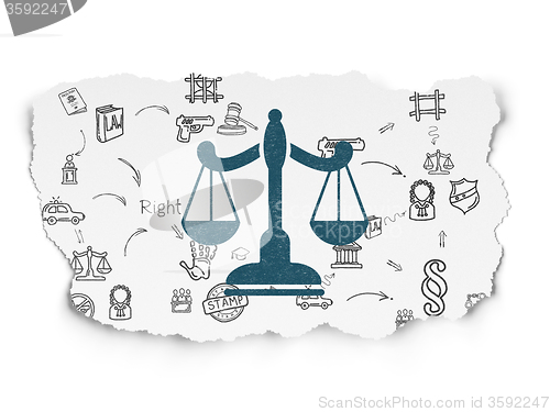 Image of Law concept: Scales on Torn Paper background