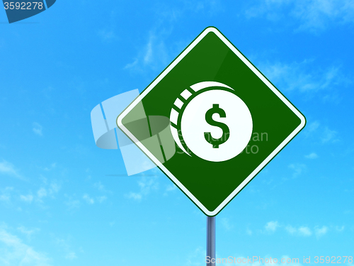 Image of Currency concept: Dollar Coin on road sign background