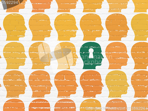 Image of Finance concept: head with keyhole icon on wall background
