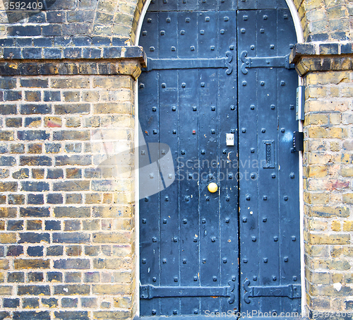 Image of wooden parliament in london old church door and marble antique  