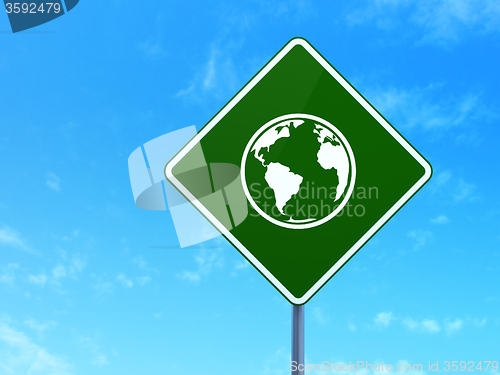 Image of Studying concept: Globe on road sign background