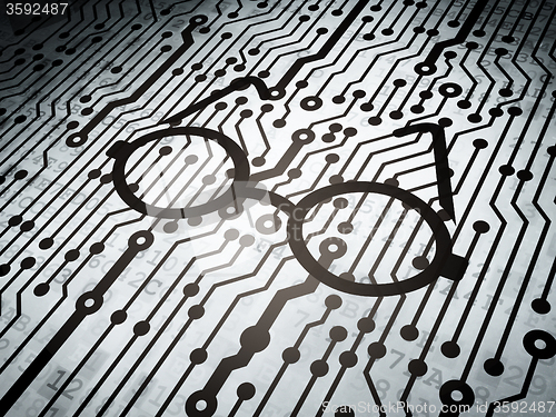 Image of Studying concept: circuit board with Glasses