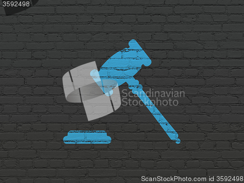 Image of Law concept: Gavel on wall background