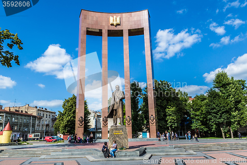 Image of monument of national Ukrainian hero S. Bandera and great trident