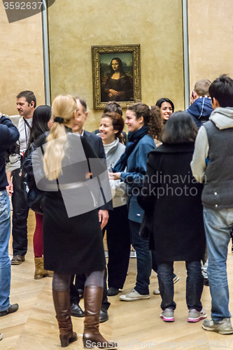 Image of Visitors take photo of Leonardo DaVinci\'s \"Mona Lisa\" at the Lou