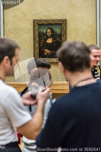 Image of Visitors take photo of Leonardo DaVinci\'s \"Mona Lisa\" at the Lou