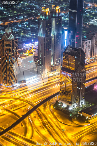 Image of Dubai downtown night scene with city lights,