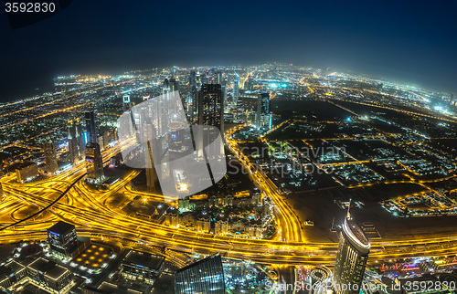 Image of Dubai downtown night scene with city lights,