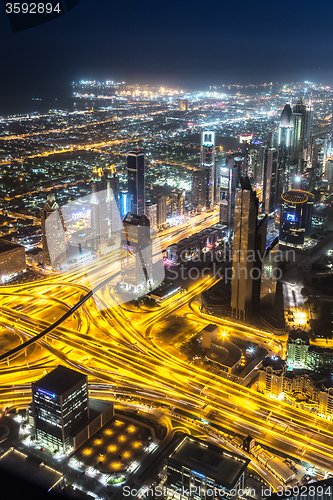 Image of Dubai downtown night scene with city lights,