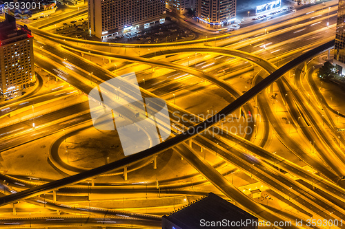 Image of Dubai downtown night scene with city lights,