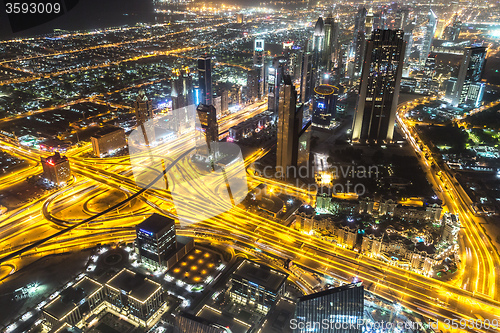 Image of Dubai downtown night scene with city lights,