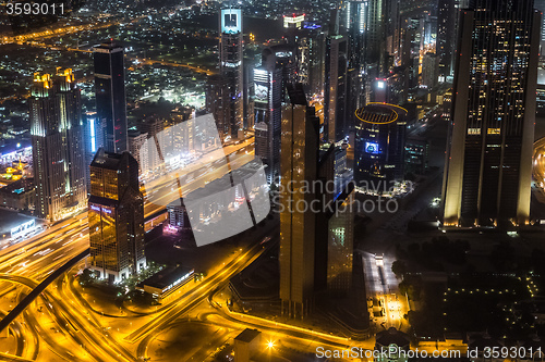 Image of Dubai downtown night scene with city lights,