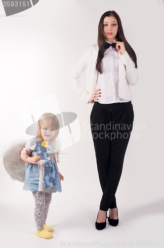 Image of Young pretty businesswoman and her daughter