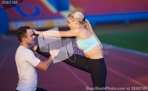 Image of sporty woman on athletic race track