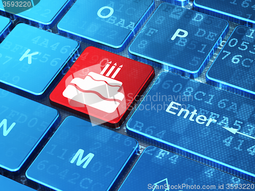 Image of Holiday concept: Cake on computer keyboard background