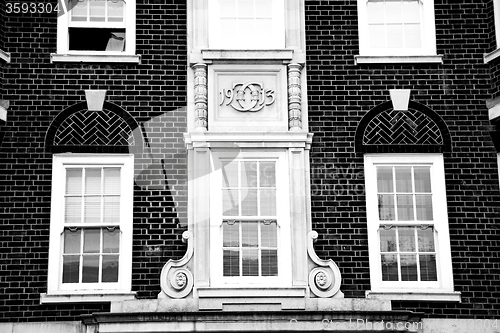 Image of old window in europe london  red brick wall and      historical 