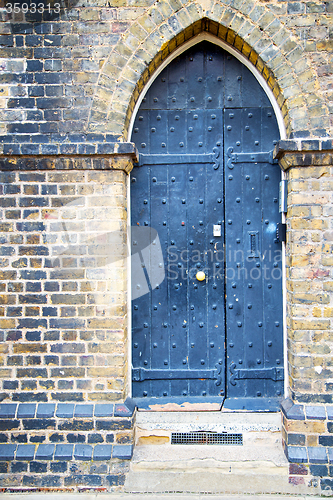 Image of wooden   in london old  and marble antique  wall