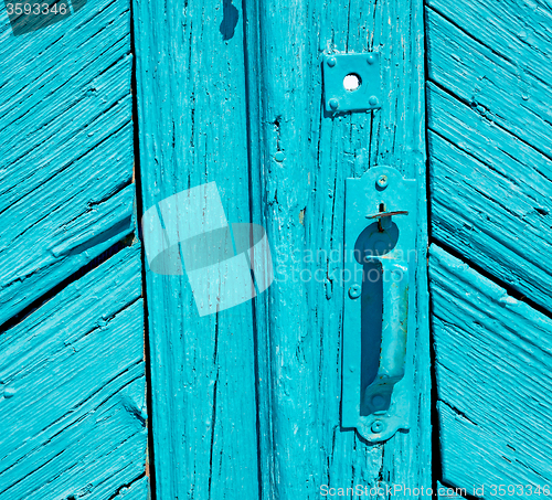 Image of greece home texture of a blue antique wooden old door in santori