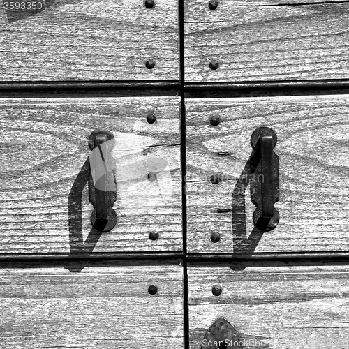 Image of door    in italy old ancian wood and traditional  texture nail