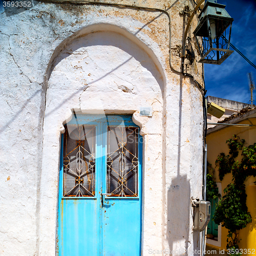 Image of blue door in antique village santorini greece europe and    whit