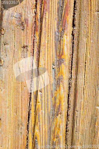 Image of grain texture of a  wooden old door in italy    