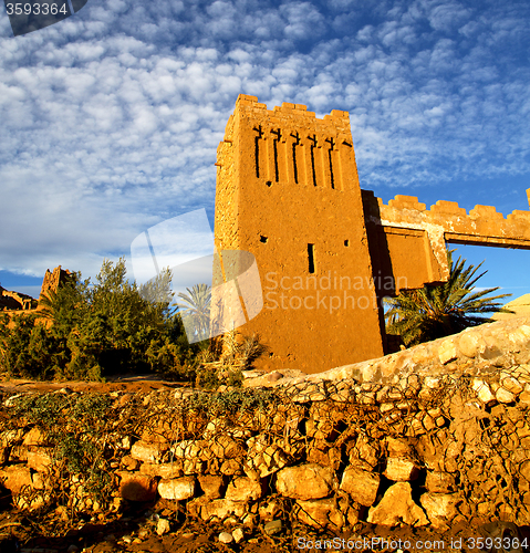 Image of africa  in histoycal maroc  old construction  and the blue cloud